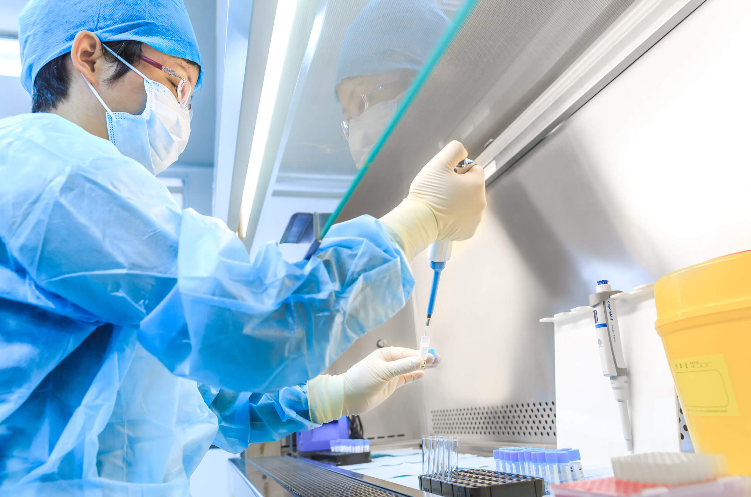 Scientist testing disinfectants in lab using EN1040 standard