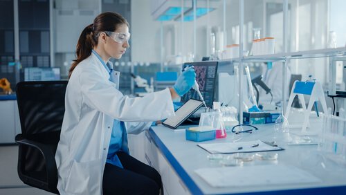 Image shows a researcher performing EN 1040 test on disinfectants used in healthcare facilities.