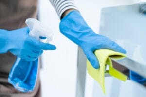 Person Cleaning with a disinfectant