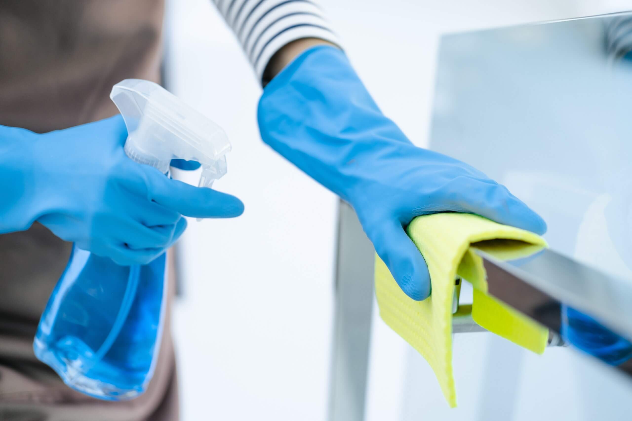 Person Cleaning with a disinfectant