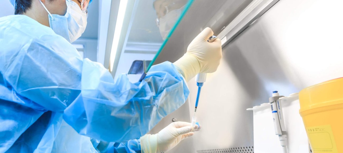 Scientist testing disinfectants in lab using EN1040 standard