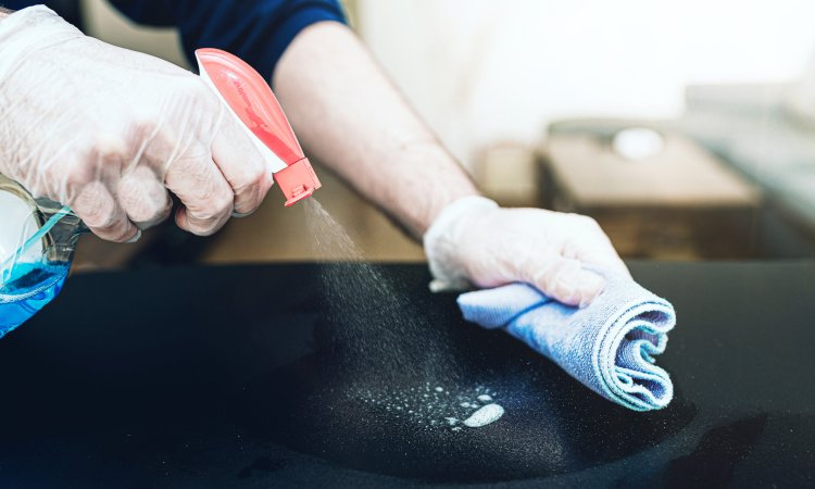 Close-up,Of,Person,Wearing,Disposable,One-way,Gloves,Using,Disinfectant,Spray
