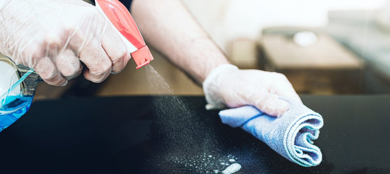 Close-up,Of,Person,Wearing,Disposable,One-way,Gloves,Using,Disinfectant,Spray