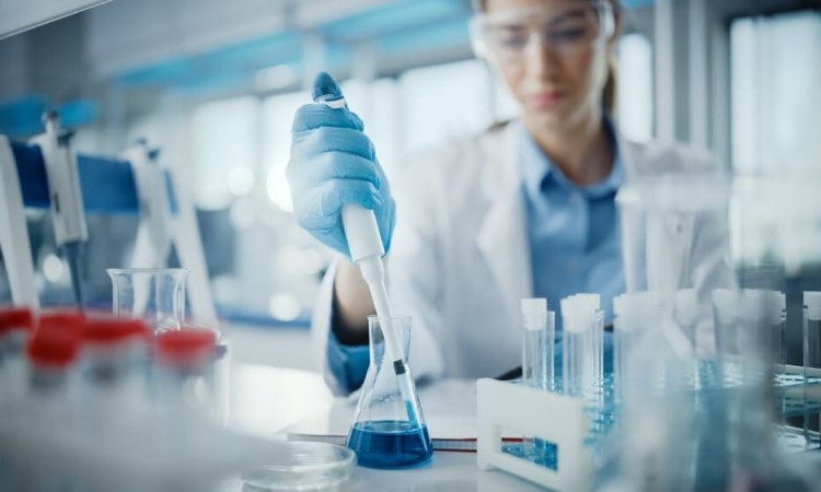 Image shows a researcher testing disinfectants as per EN 1040 standards