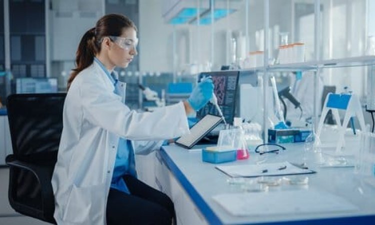 Image shows a researcher performing EN 1040 test on disinfectants used in healthcare facilities.