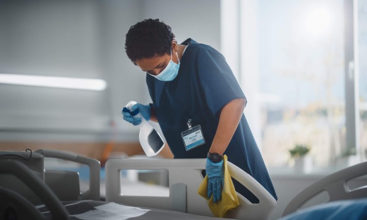 Hospital,Ward:,Professional,Black,Nurse,Wearing,Face,Mask,,Wiping,The